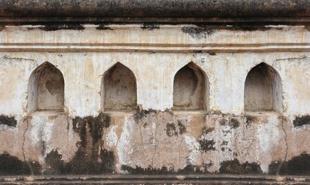 Thai dirty old weathered Arch style wall texture background.