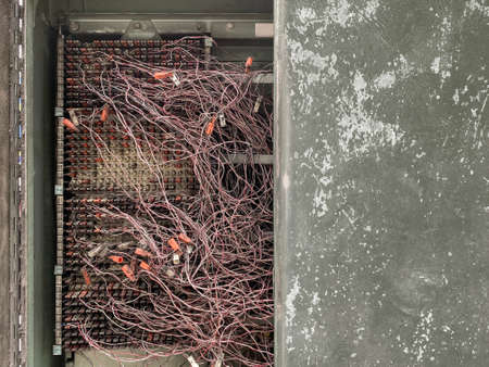 old dirty Cable connection telecommunication panel platform closet background.