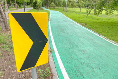 direction arrow asphalt for ridding bicycle lane at outdoor park.の写真素材
