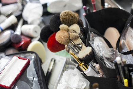 makeup artist brush applying eye shadow on faceの写真素材