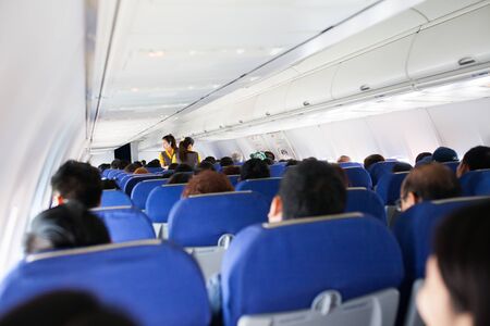 blur background in Interior of airplane with passengersの写真素材
