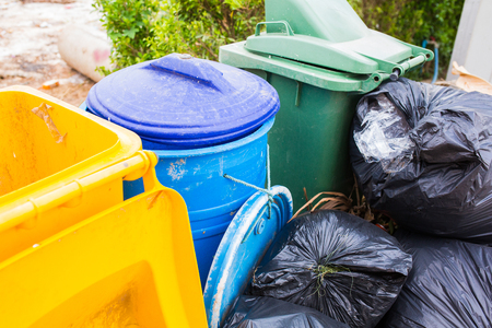 Piles of garbage in plastic bin bags (trash, waste) in City.の写真素材