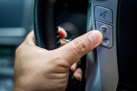 Close up wireless speaker control buttons on car.の写真素材