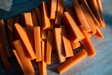 Closeup of fresh organic carrots sliced on the table.