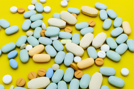Pile of colorful pills drugs and tabletsの写真素材