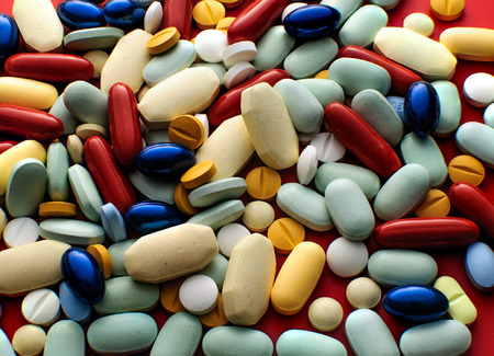 Pile of colorful pills drugs and tabletsの写真素材