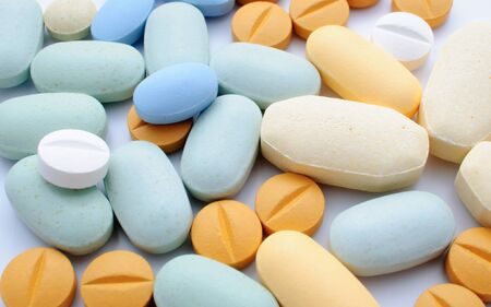 Pile of colorful pills drugs and tabletsの写真素材