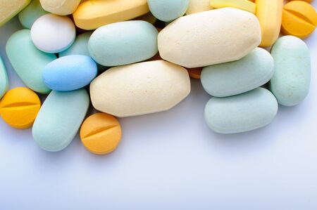 Pile of colorful pills drugs and tabletsの写真素材