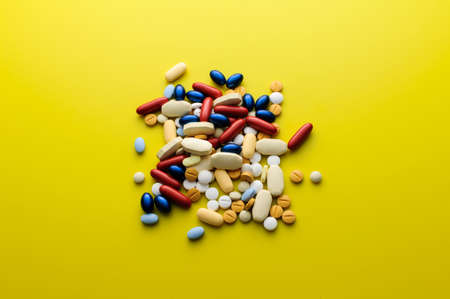 Pile of colorful pills drugs and tabletsの写真素材