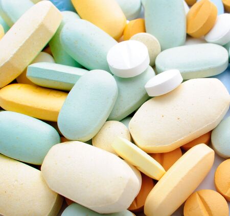 Pile of colorful pills drugs and tabletsの写真素材