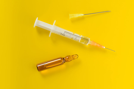 Medical vial for injection with a syringe and needleの写真素材