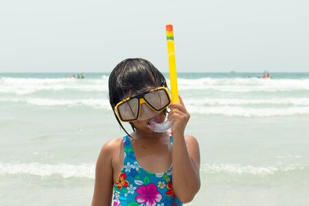 happy little girl wearing swimsuitの写真素材