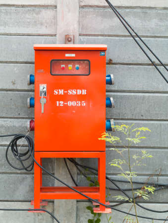 electric connection metal box for small village stand on garden grass. Selective focusの写真素材