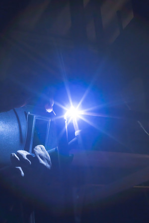Worker welding aluminum using tig welder