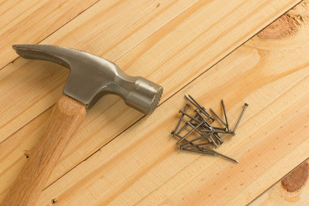 Hammer and nails on wood