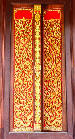architecture by Thai style on the doors of Buddha churchの写真素材