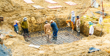 Foundation site of new details and reinforcements with steel bars and wire rod, preparing for cement pouringの写真素材