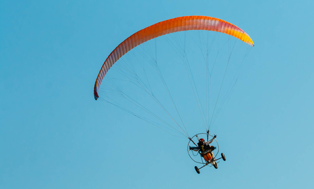 Para-motor flying in the skyの写真素材