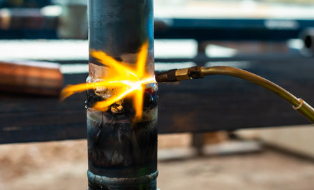 welding of steel pipe in factory, closeup of photoの写真素材