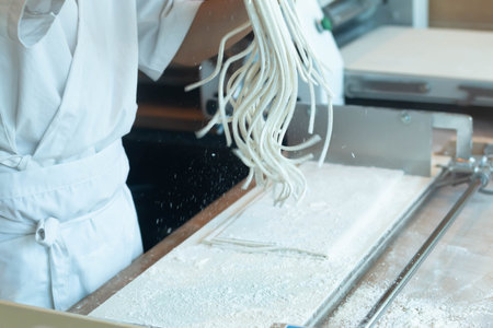 Chef making raw udon japanese noodleの写真素材
