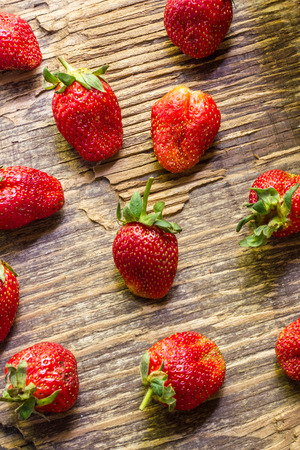 Fresh strawberry paste spread on wooden background.の写真素材