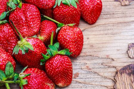 Fresh strawberries on a wooden backgroundの写真素材