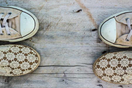 Sneakers and shoes on a wooden background.の写真素材