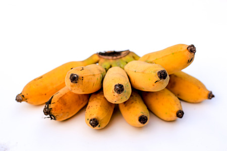 Ripe bananas on white background, shallow DOF.の写真素材