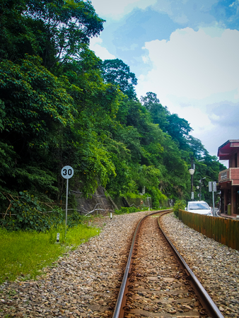 railroad with a sign on the leftの写真素材