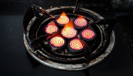 red gas stove with black backgroundの写真素材