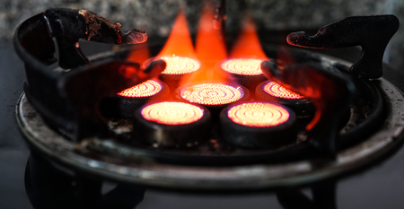 red gas stove with black backgroundの写真素材