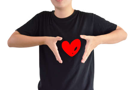 Asian man wear black shirt show red heart and white backgroundの写真素材