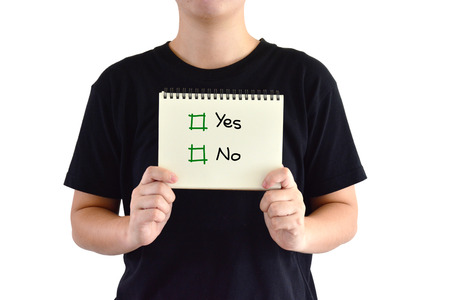 Asian man wear black shirt show yes or no on note and white backgroundの写真素材