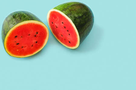 Top view watermelon on blue  background with copy space for summer holiday and vacation concept.の写真素材