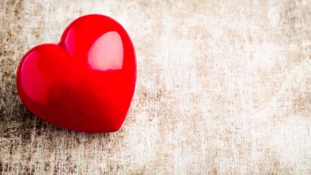 red heart on wooden background with copy spaceの写真素材