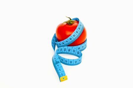 A red apple and a blue tape wrapped around