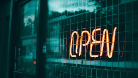 Evening, Orange light bulb, write " OPEN " in Karaoke shopの写真素材