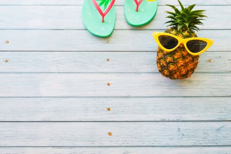 summer holidays vacation concept,pineapple watermelon on wooden background with copy spaceの写真素材