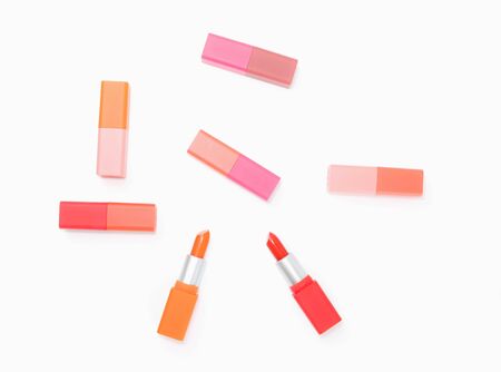 top view of colorful pastel lipstick arranged on white backgroundの写真素材