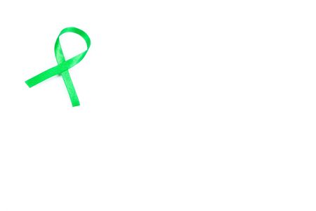 green organ transplant awareness ribbon on white background.Kidneys cancer .healthcare and medicine conceptの写真素材