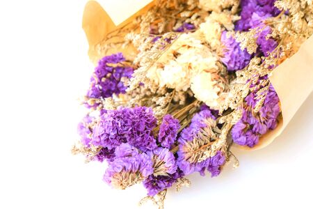 Purple dried flowers in brown craft paper bouquetの写真素材