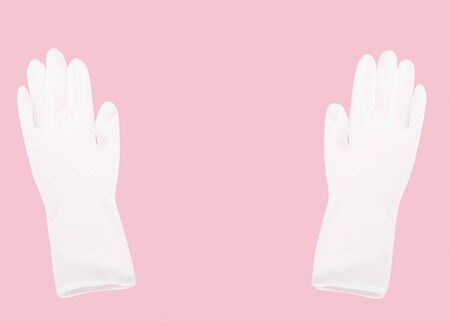 White latex medical gloves  isolated on pink background with copy space,health care conceptの写真素材