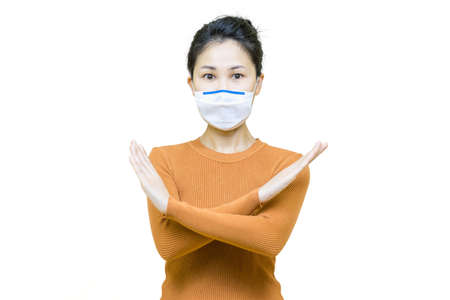 Young asian woman in brown shirt wore medical face mask isolated on white background, health care concept.の写真素材