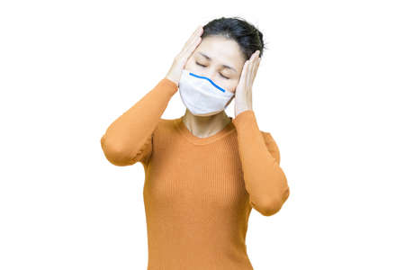 Headache,Young asian woman in brown shirt wore medical face mask isolated on white background,health...