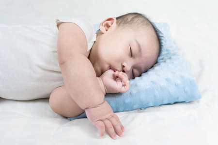 Selective focus portrait of a sleeping Charming babyの写真素材
