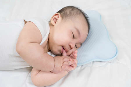 Selective focus portrait of a sleeping Charming babyの写真素材