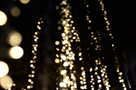 Yellow decorate light with black bckgroundの写真素材