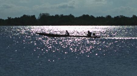 a fishing boat in the lakeの写真素材