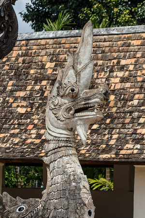 old Naga statue in thai templeの写真素材
