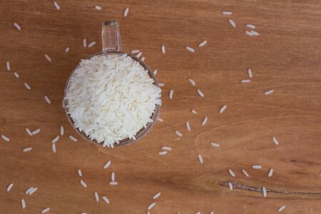 White long rice background, uncooked raw cereals, macro closeupの写真素材